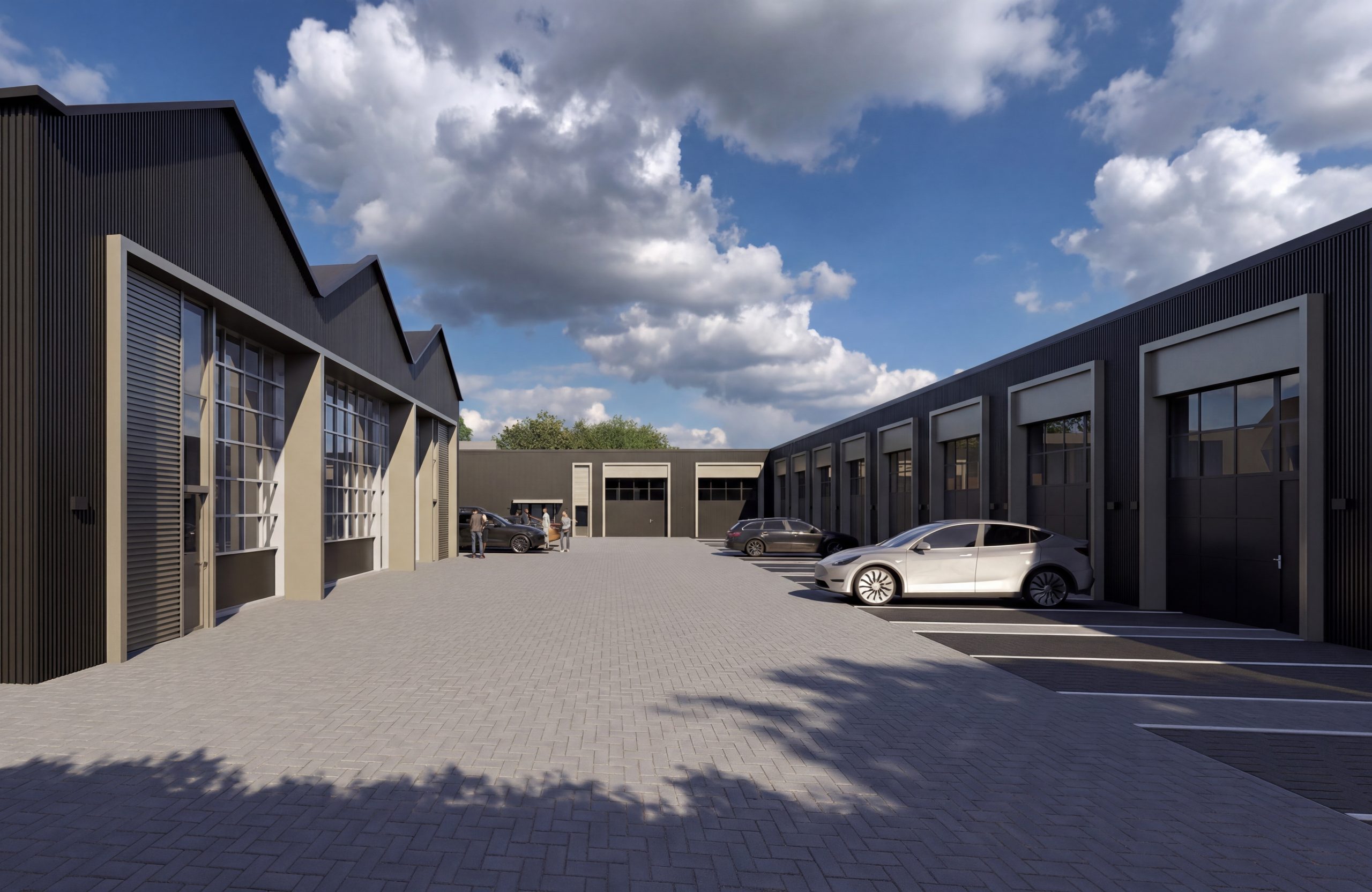 Zicht op het binnenterrein van ELSTER 11 met moderne antracietkleurige bedrijfsunits in Elst, voorzien van overheaddeuren en parkeergelegenheid.